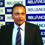 Anil Ambani, chairman of the Reliance Anil Dhirubhai Ambani Group, poses for photographers before addressing the annual shareholders meeting in Mumbai