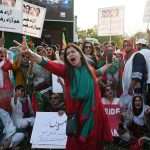 Supporters of ruling PTI